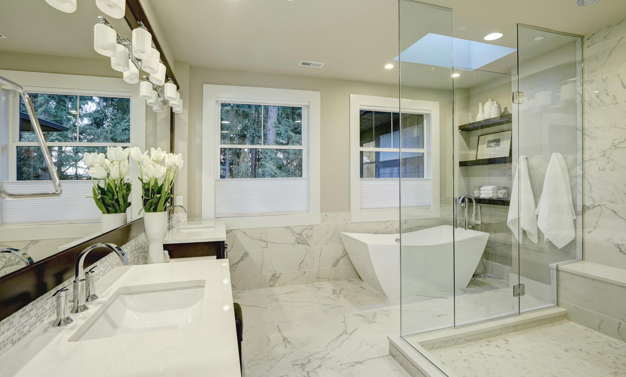 bathroom with two sinks, bath and shower